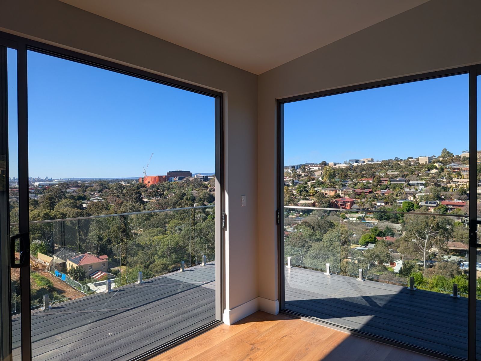 Floor-to-ceiling corner windows in a rental property managed by APN